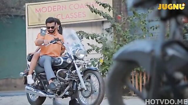 Hot Indian guy in sunglasses rides motorcycle with girl on back, Jugnu web series