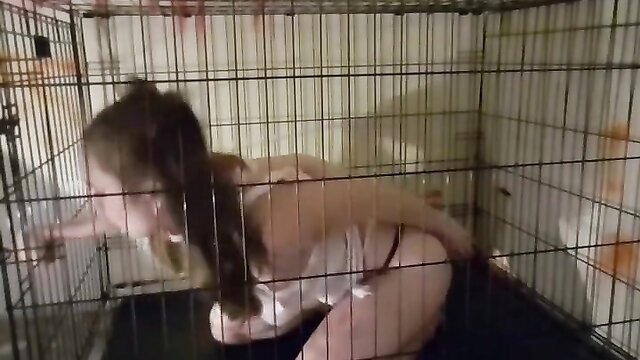 Caged amateur with big tits reaches out nude on webcam