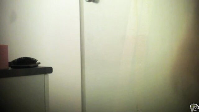 Amateur teen undresses in bathroom, teasing strip solo