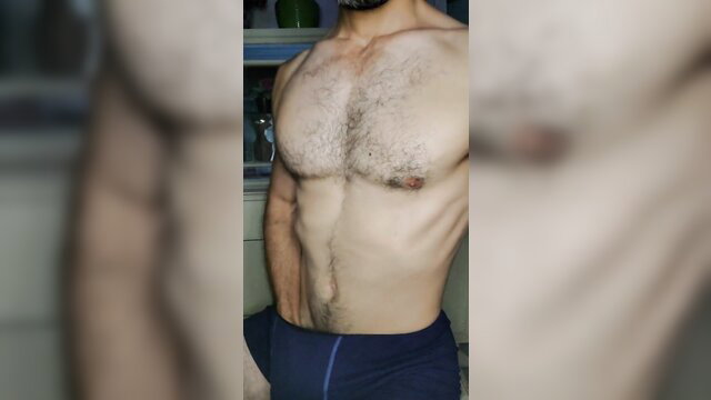 Klaus Joe admires his hairy muscular torso in tight underwear