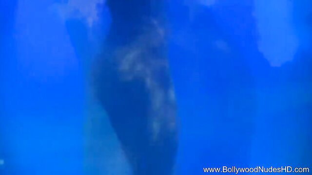 Blurry blue-lit silhouette of nude Indian woman with big ass in HD porn thumbnail