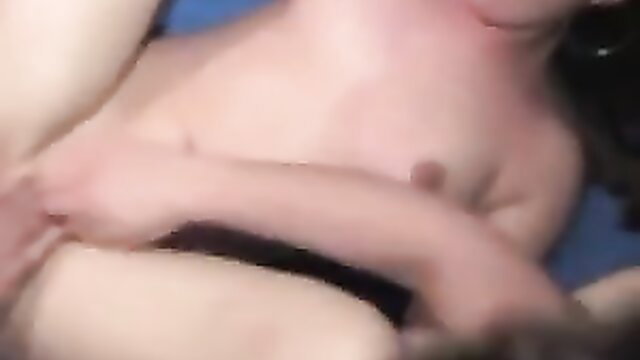 Blonde teen in intense gangbang at porn cinema, surrounded by men