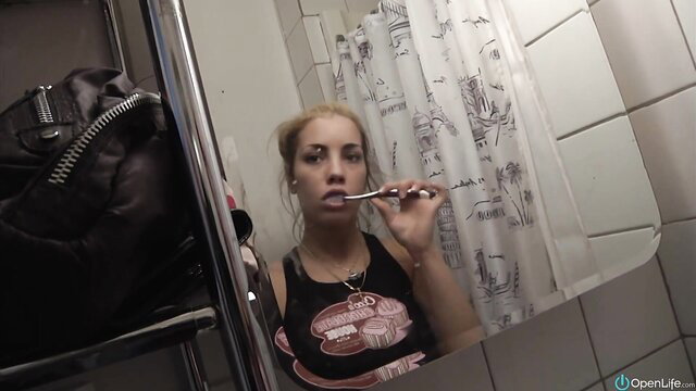 Shana Lane brushing teeth in tank top, girlfriend amateur bathroom selfie