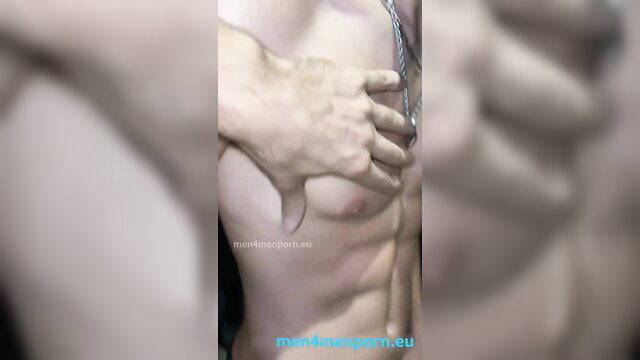 Leo Valentino flexing abs as hand touches his muscular twink chest