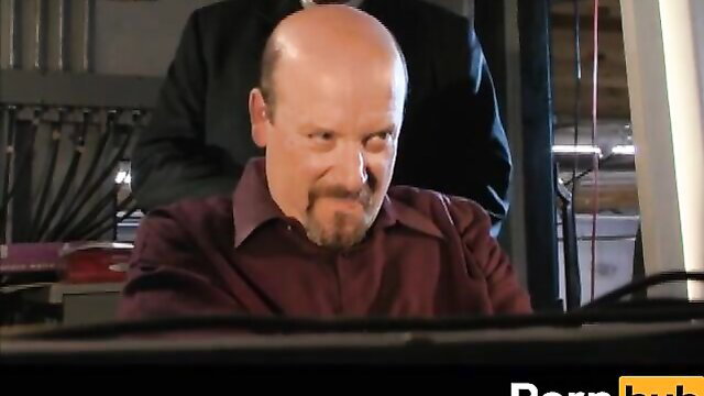 Bald mature man in suit at desk in hardcore scene from X Marks The Spot