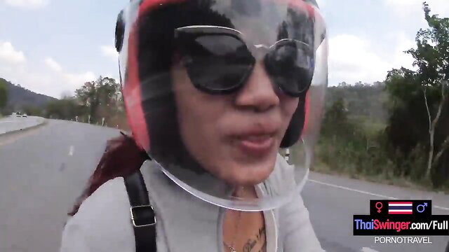 Thick Thai swinger in helmet on motorcycle, amateur public tease