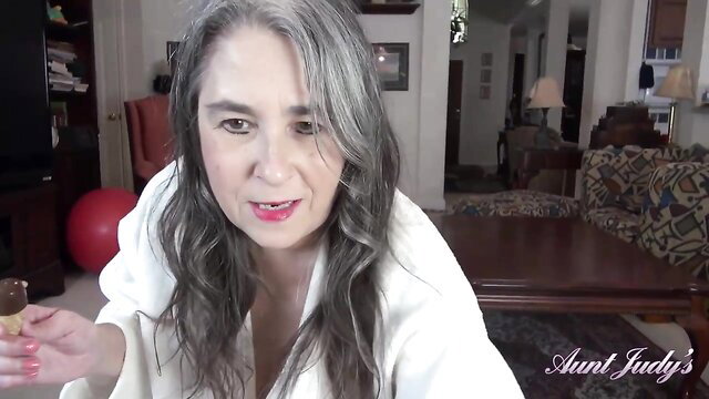 Aunt Judy in robe licks ice cream cone seductively