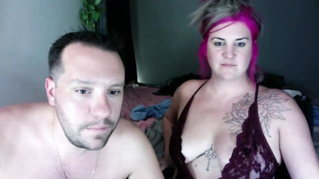 adifanshow1 pink-haired busty woman in lace lingerie teases with man on Chaturbate