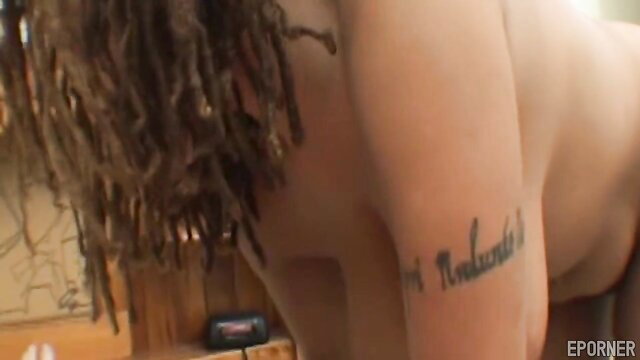 Horny black MILF with dreads tattooed arm nude teasing ass view