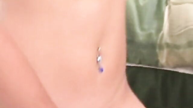 Closeup of girl's bare midriff with purple navel piercing