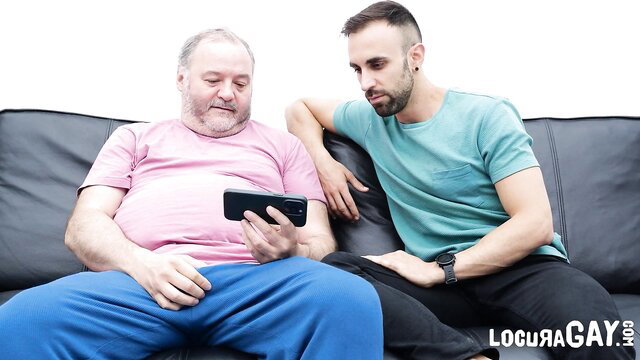 Chubby older man masturbates phone with excited young guy watching