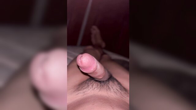 Amateur solo Asian guy stroking hard cock closeup