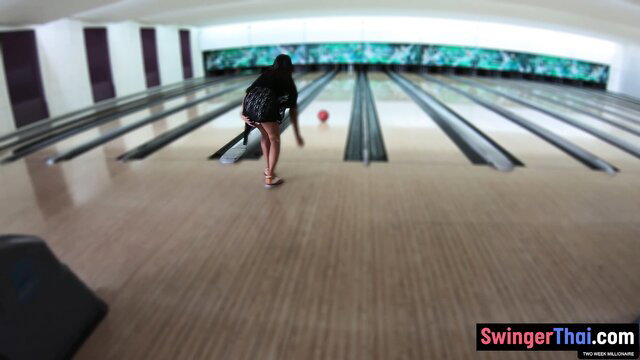 Thai GF in mini skirt bending over bowling lane