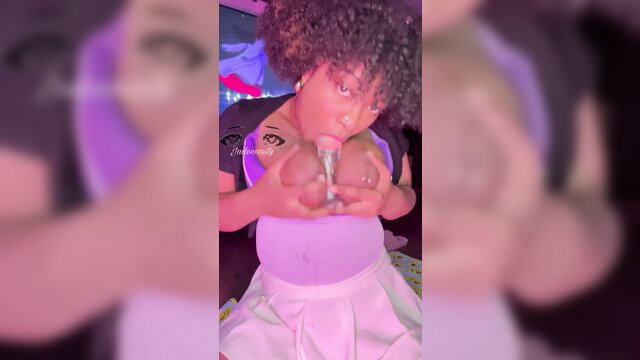 Excited black cutie with big tits holds dildo, squirt tease