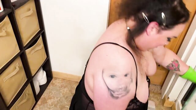BBW with huge tits in black lingerie cleaning, topless tease