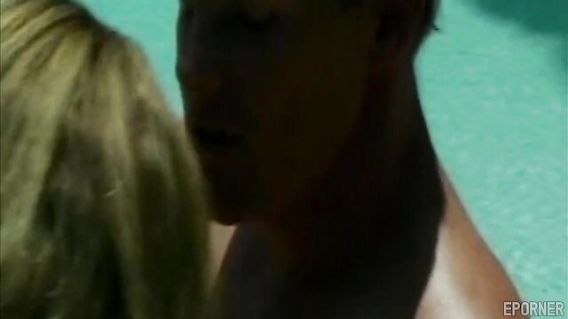Blonde babe with huge tits teases hunk by pool in hot sex clip