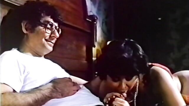 Vintage 1981 porn scene: hairy man watches busty brunette babe suck him off