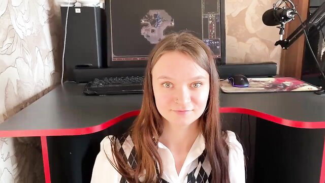 Cute teen stepdaughter in schoolgirl top at gaming desk blows stepdad