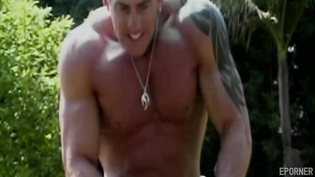 Muscular white hunk flexing outdoors by pool in Fun In The Sun