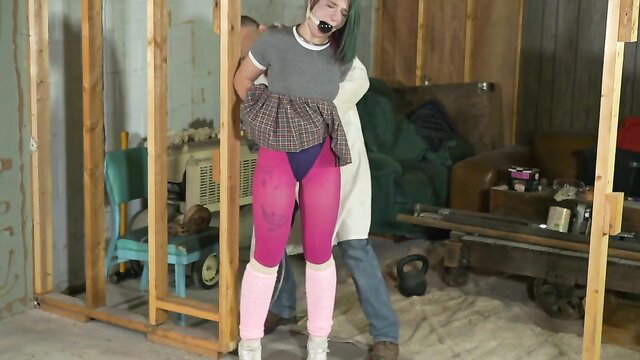 Bound green-haired brat in plaid skirt, pink tights, gagged in futile struggles challenge