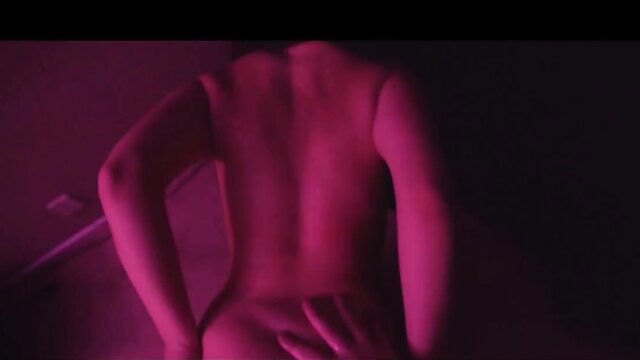 Jackie Ohh nude back view ass tease in pink lit sex dungeon