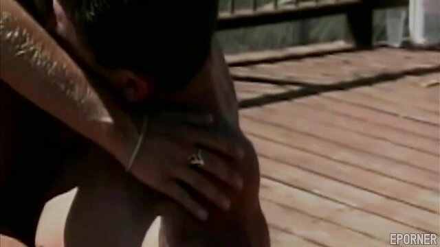 Tanned hunk kneeling on deck, sweaty arms gripping knees in erotic pose