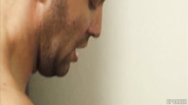 Closeup of handsome bearded man's aroused face in raunchy xxx video