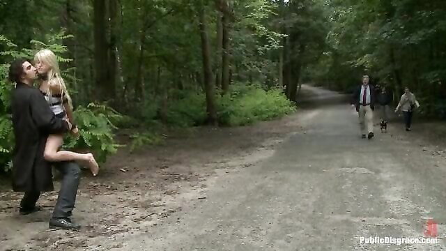 Slim blonde held up in forest by man, public outdoor tease