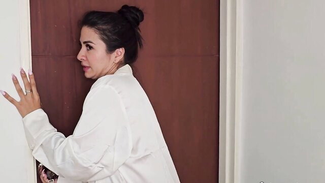 Danna Mendez peeking seductively in white blouse, big tits tease