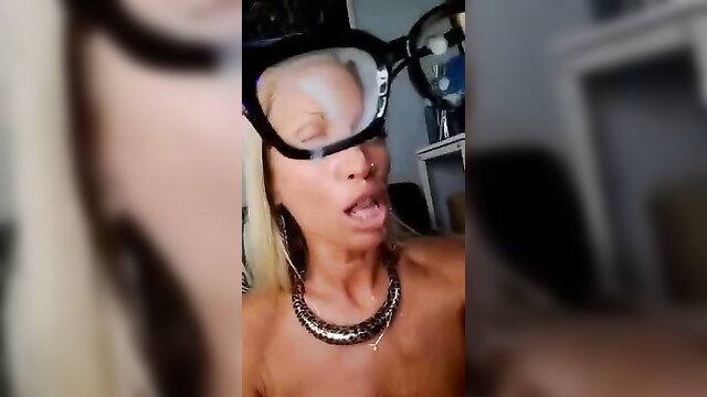 Blonde bombshell in big glasses with open mouth, ready for facial cumshot