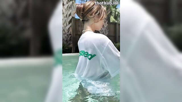 Natalie Roush wet poolside in white Speedo tee, blonde hair up
