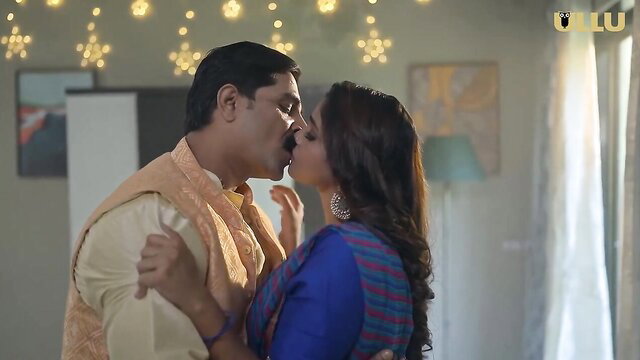 Indian chubby couple passionate kiss in traditional attire