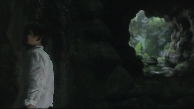 Yuki Amami in cave, white shirt, Inugami 2001 erotic scene