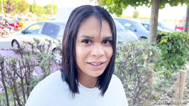 Laya 25yo French salesgirl in white tee smiling outdoor