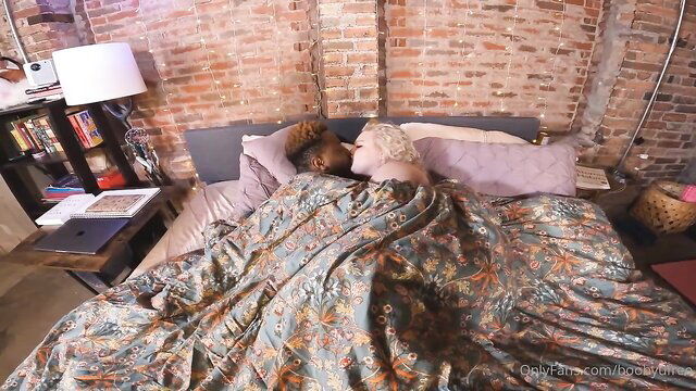 Blond PAWG cuddling Black Pen under sheets in bed