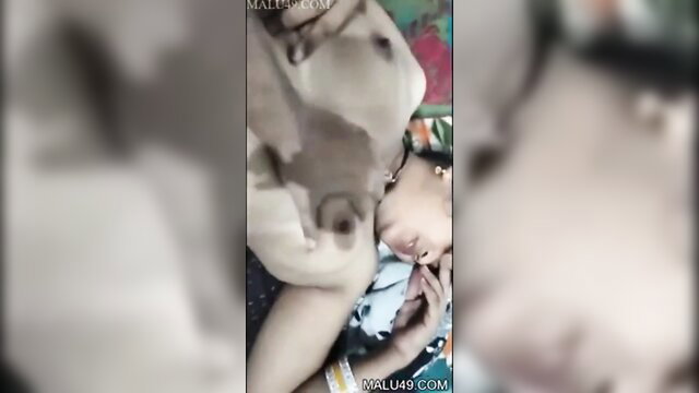Horny Indian village girl breastfeeding puppy closeup