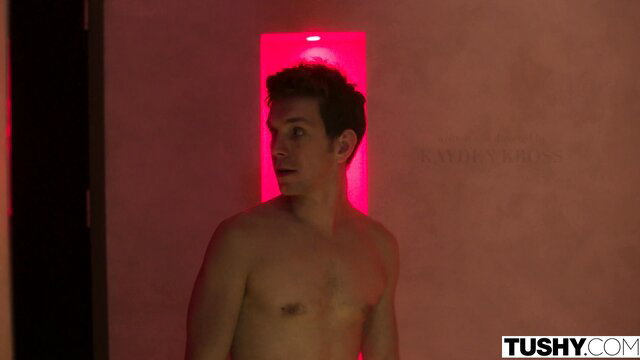 Nude man in steamy red-lit room from Tushy threesome