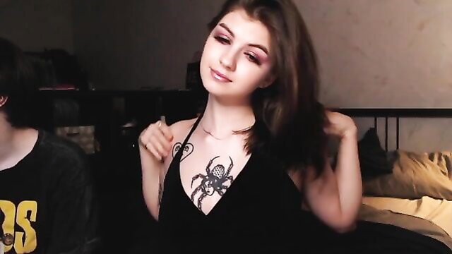 Curvy brunette with spider tattoo teases in black dress amateur style