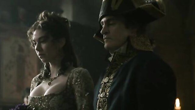 Vanessa Kirby sexy cleavage in low-cut gown with Napoleon actor