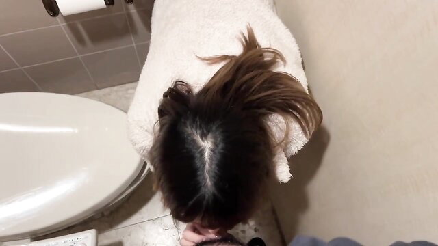 Asian woman in towel bent over toilet exposing bra panty shots