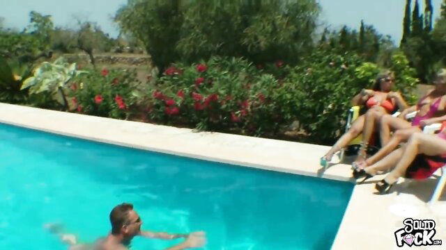 Three busty German MILFs in bikinis watch man in pool on holiday