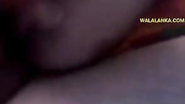 Blurry Sri Lankan amateur woman closeup in dim light