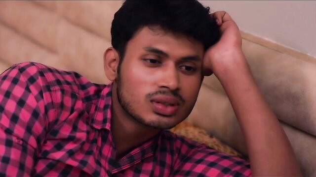 Handsome young Indian man in checkered shirt, seductive gaze
