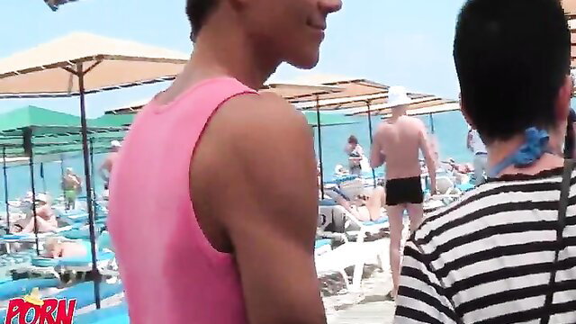 Hot Asian guys in pink tanks on crowded Turkey beach vacation