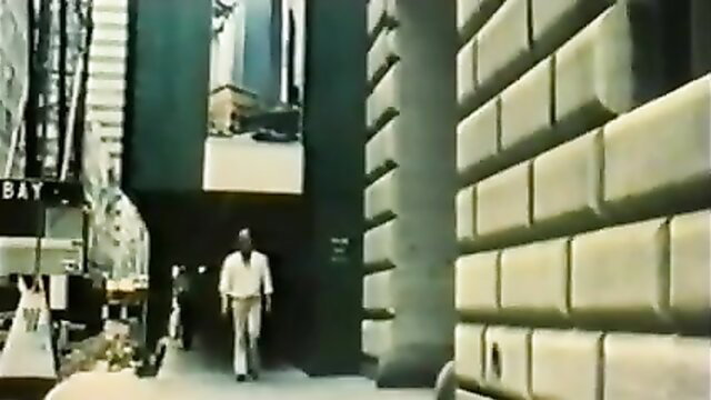 Man in white suit walking urban alley, Flying Sex 1980 retro porn thumbnail
