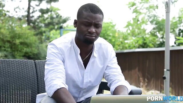 Jennifer Mendez with black stud outdoors in white shirt, laptop tease