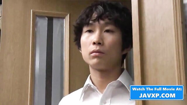 Handsome young Asian man in white shirt peeking from door