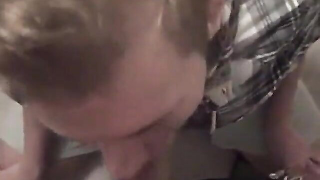 Sexy blond kneels swallowing huge cum load closeup