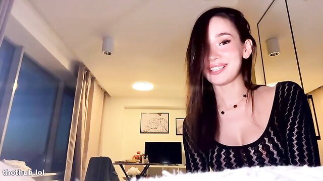 Ellie Leen smiling in sexy black lace top cam show