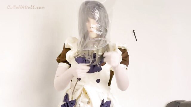 Japanese teen maid in plastic bag hood holds up white dress panties tease